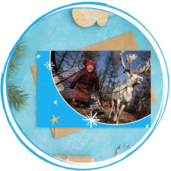 Karácsonyi képeslap (kislány rénszarvassal)